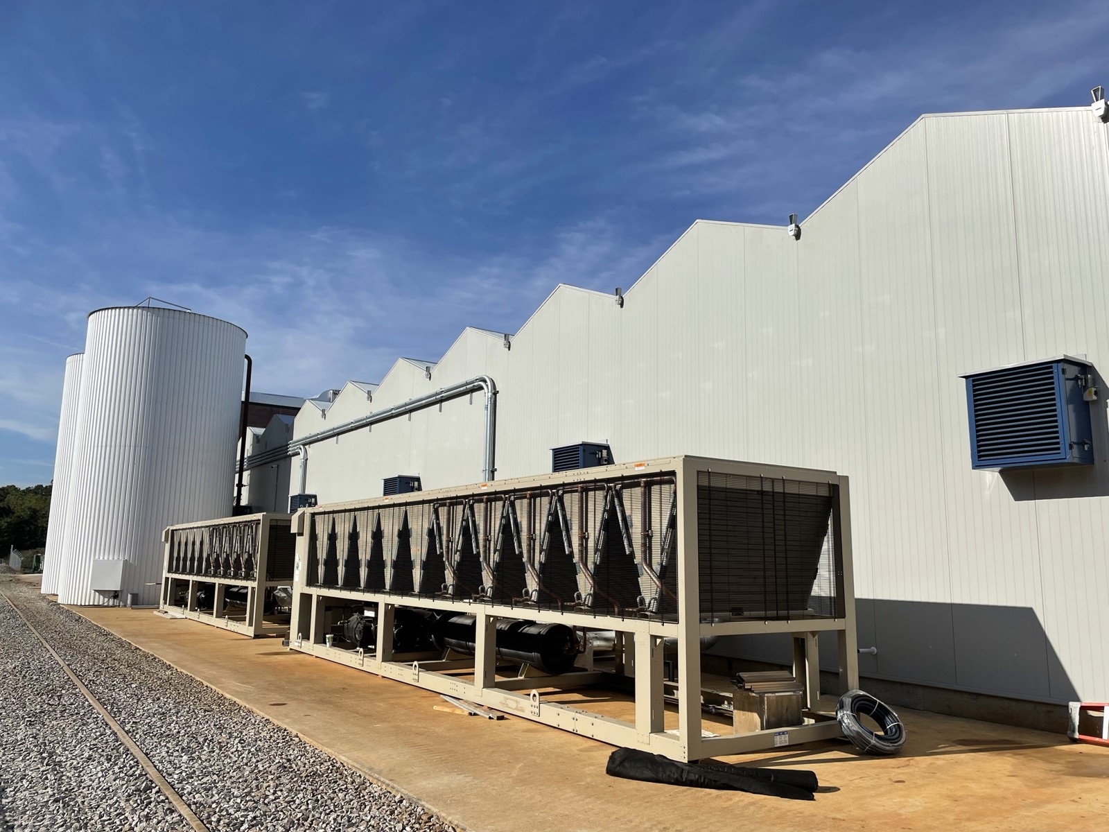 Exterior of a greenhouse service building beside the growing facility