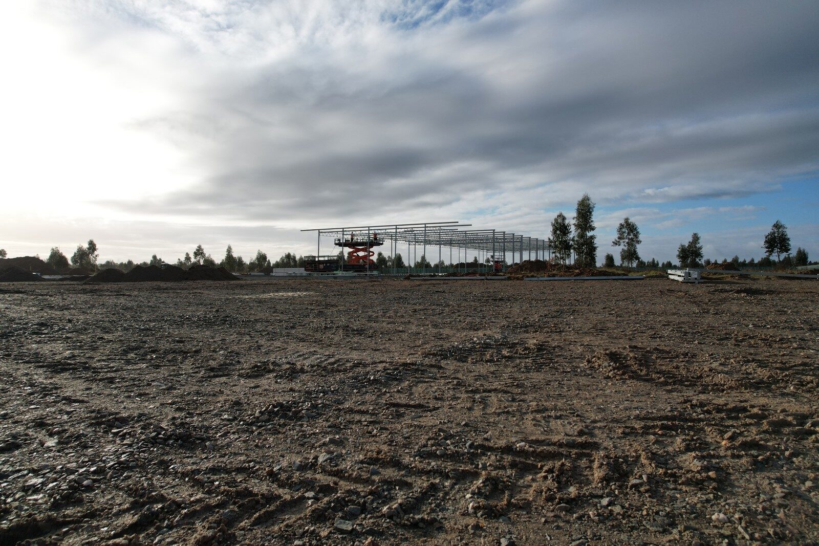 Aerial view of galvanised steel structure during greenhouse construction